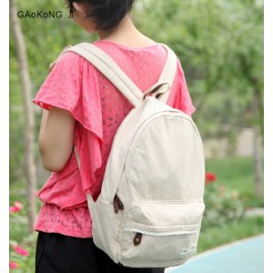 beige Polka dot backpacks